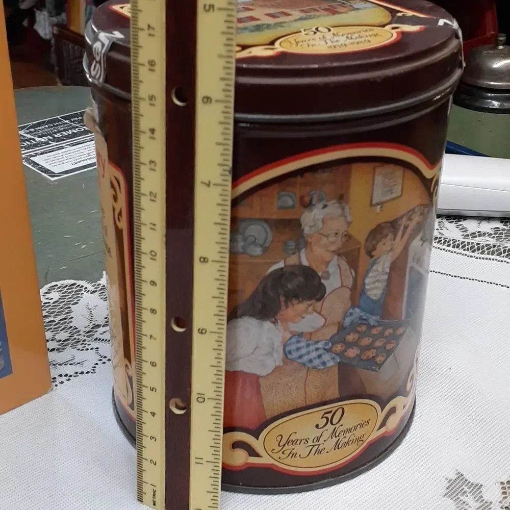 3-pc. Nestle's chocolate bundle: 2 vintage‎ tins and a hardcover cookbook